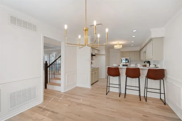 a open kitchen with cabinets and stainless steel appliances
