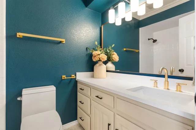 a bathroom with a toilet and a sink