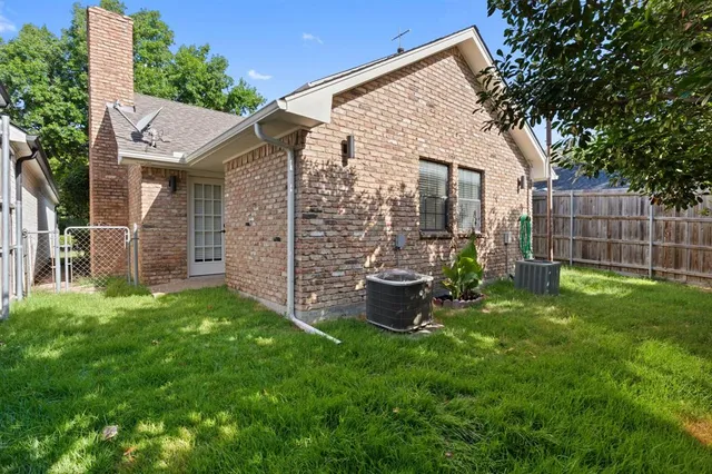 a view of a house with backyard porch and sitting area