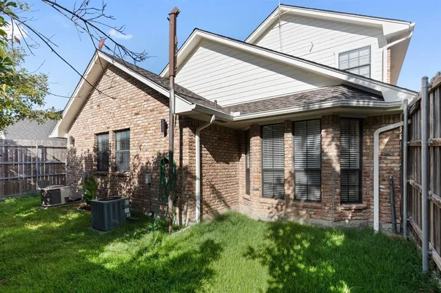 a front view of a house with a yard garage and outdoor seating