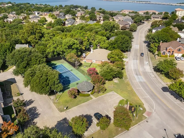 an aerial view of a house with a yard