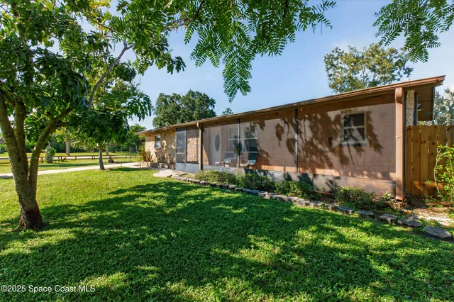 a view of a back yard with green space