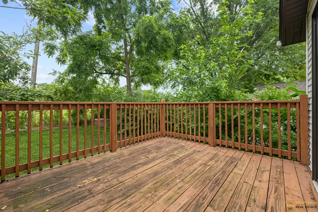 an aerial view of a house with backyard