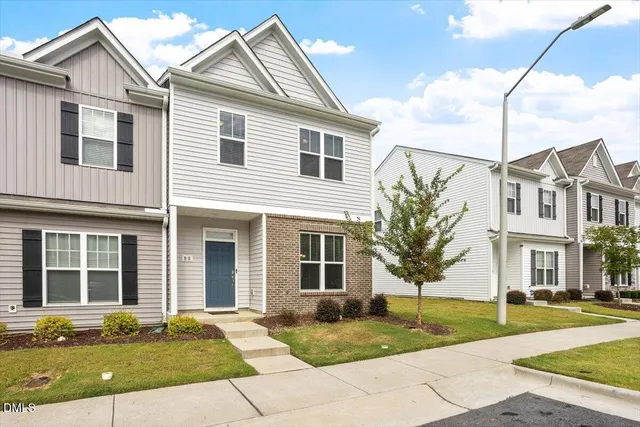 a front view of a house with a yard