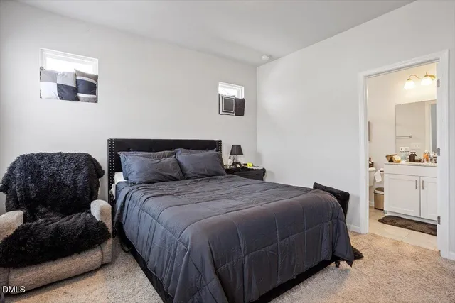 a bedroom with a bed and a cabinets