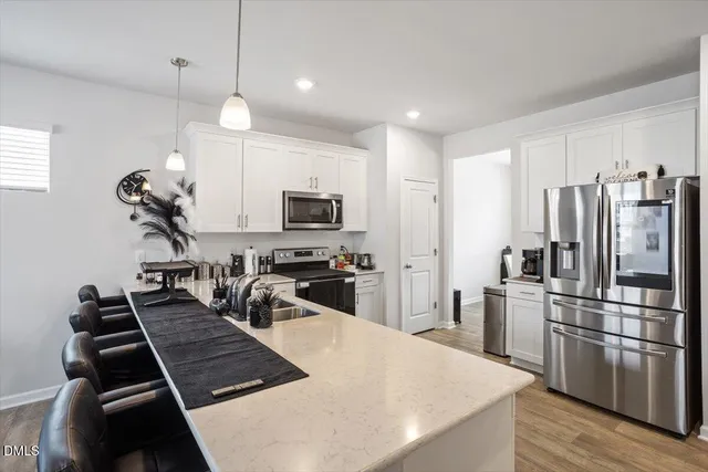 a kitchen with kitchen island a counter and a stove