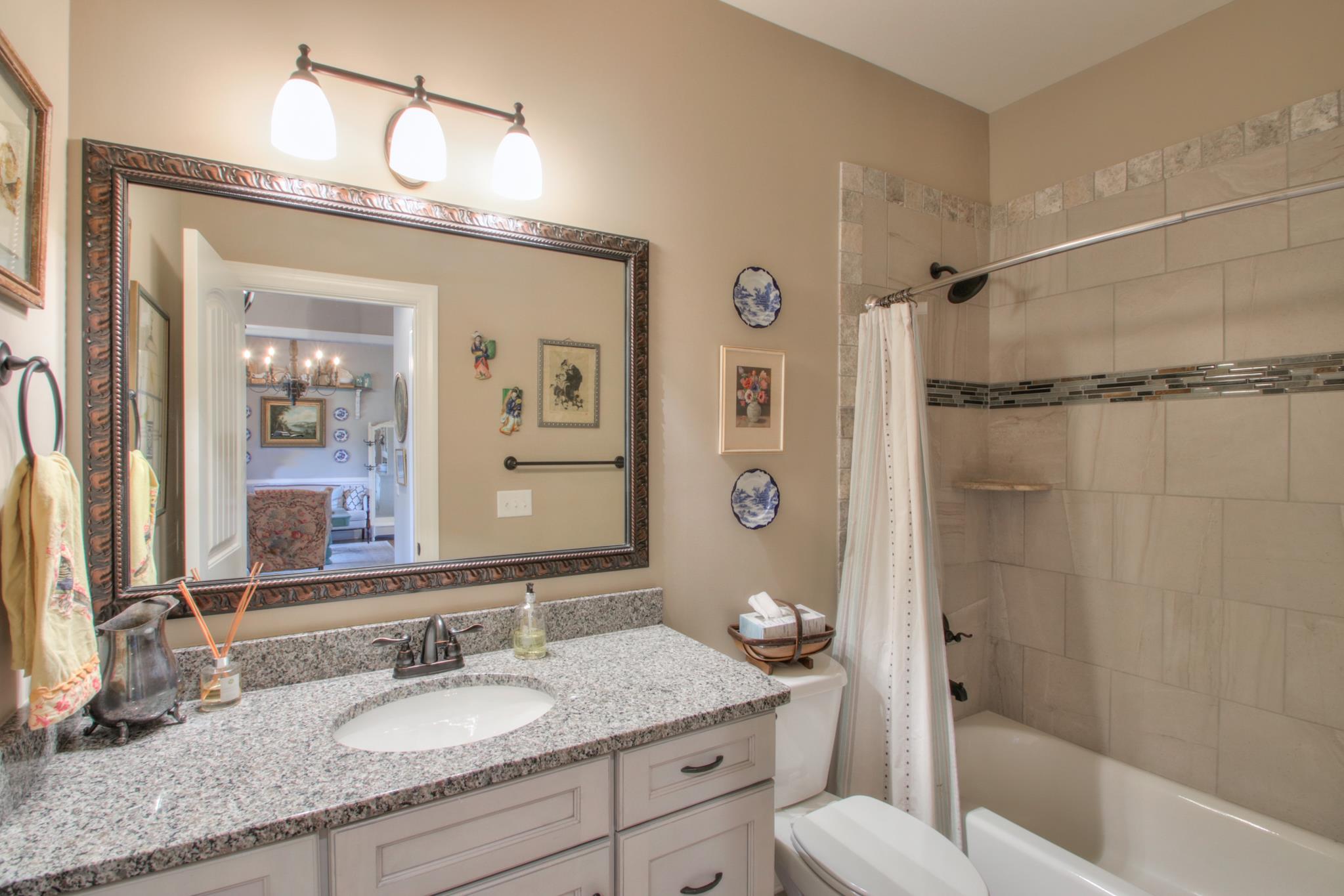 6928 Cairo Bend Road Lebanon, TN 37087 - Photo 5 of 30 This is the front bathroom. Notice the tile surround.