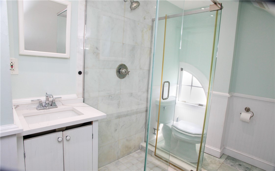 34 Bull Street Newport, RI 02840 - Photo 19 of 34 This custom glass shower and marble flooring make up this 2nd bathroom. Unit 2