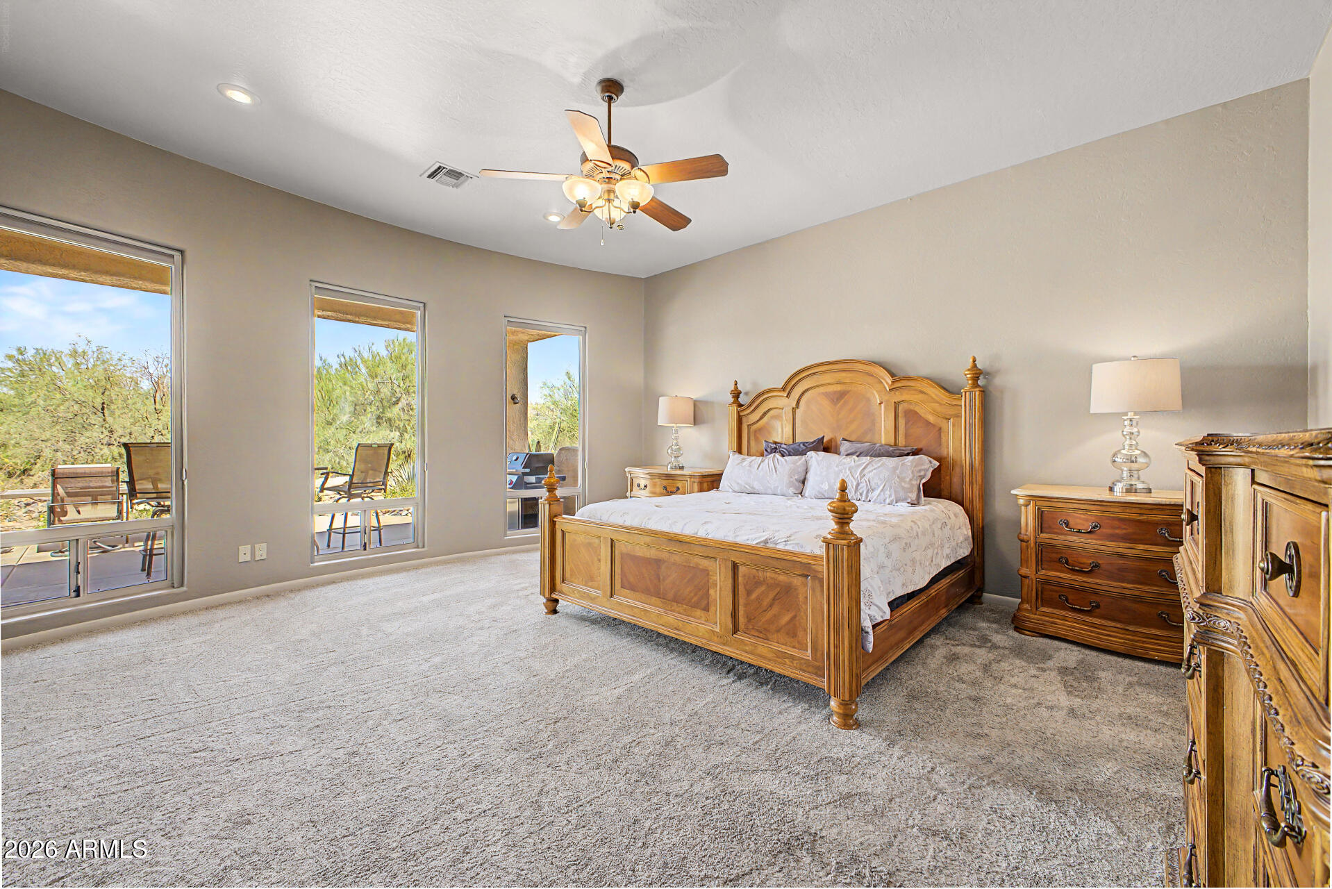 27909 North Quail Spring Road Rio Verde, AZ 85263 - Photo 15 of 52 a bed sitting in a spacious bedroom next to a window