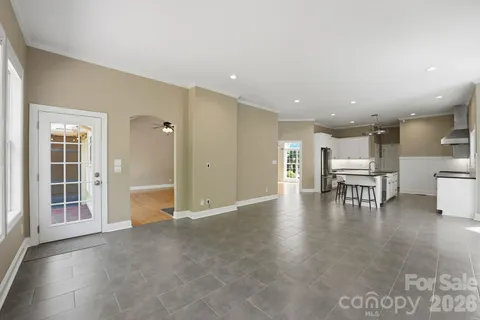 a view of a livingroom with furniture and an empty room