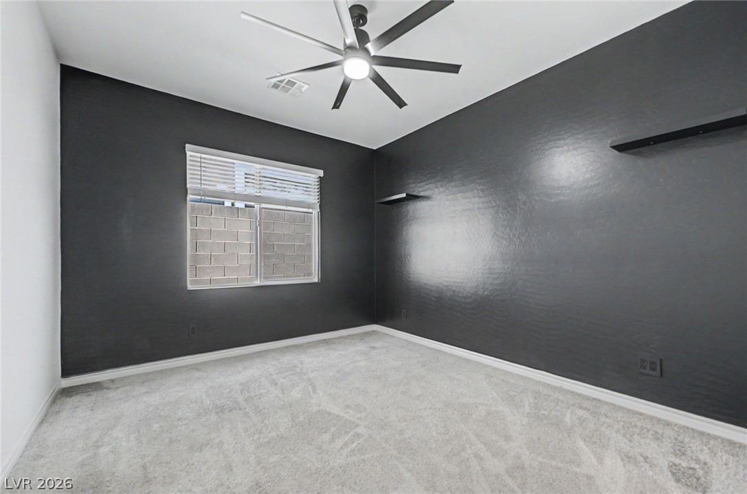 226 Augusta Ridge Henderson, NV 89015 - Photo 23 of 47 This spacious room features a window offering ample natural light and a stylish ceiling fan.