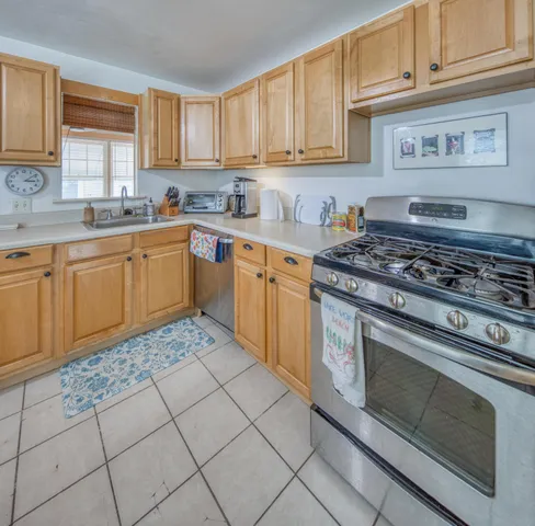 a kitchen with cabinets and appliances
