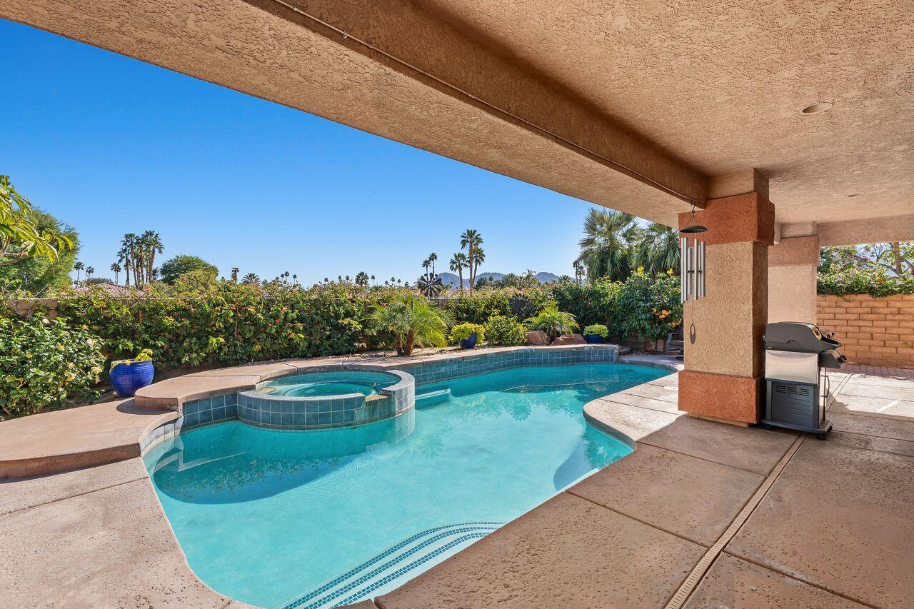 28 White Sun Way Rancho Mirage, CA 92270 - Photo 17 of 43 a view of a swimming pool with a patio
