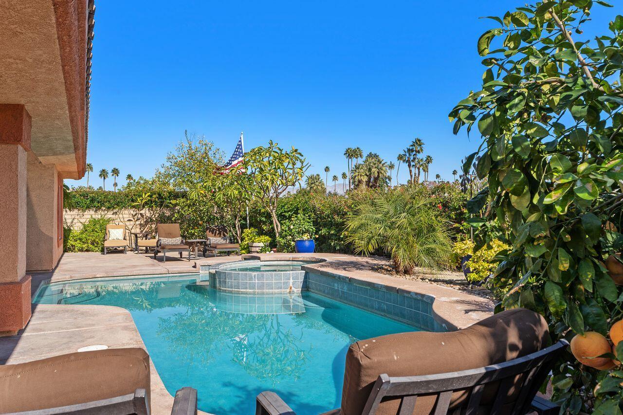 28 White Sun Way Rancho Mirage, CA 92270 - Photo 18 of 43 a view of a backyard with sitting area