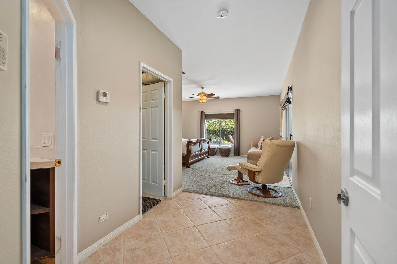 28 White Sun Way Rancho Mirage, CA 92270 - Photo 24 of 43 a view of a workspace with furniture and a window