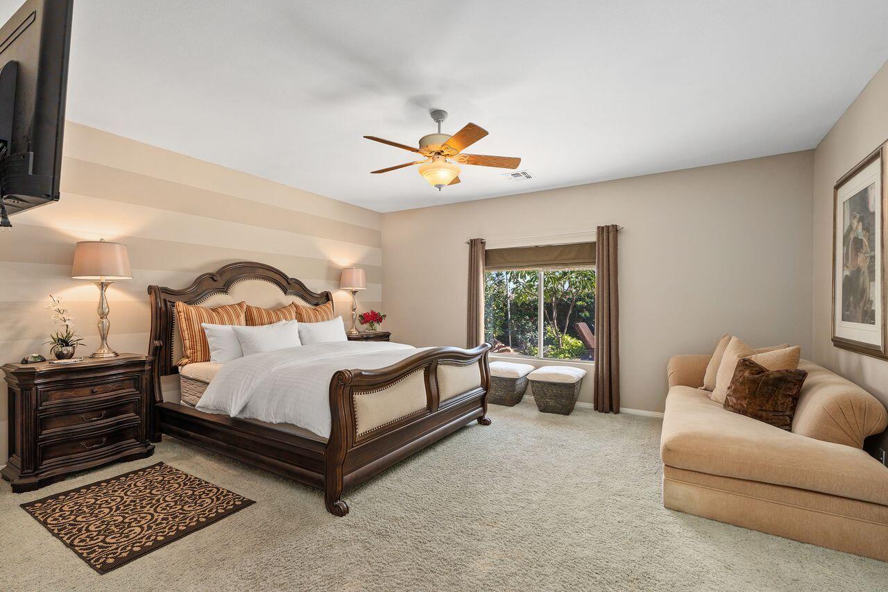 28 White Sun Way Rancho Mirage, CA 92270 - Photo 25 of 43 a bedroom with a bed and a couch