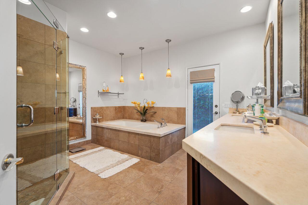 28 White Sun Way Rancho Mirage, CA 92270 - Photo 27 of 43 a bathroom with a tub sink and mirror