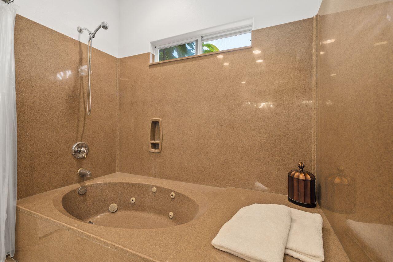 28 White Sun Way Rancho Mirage, CA 92270 - Photo 31 of 43 a bathroom with a sink a toilet and shower