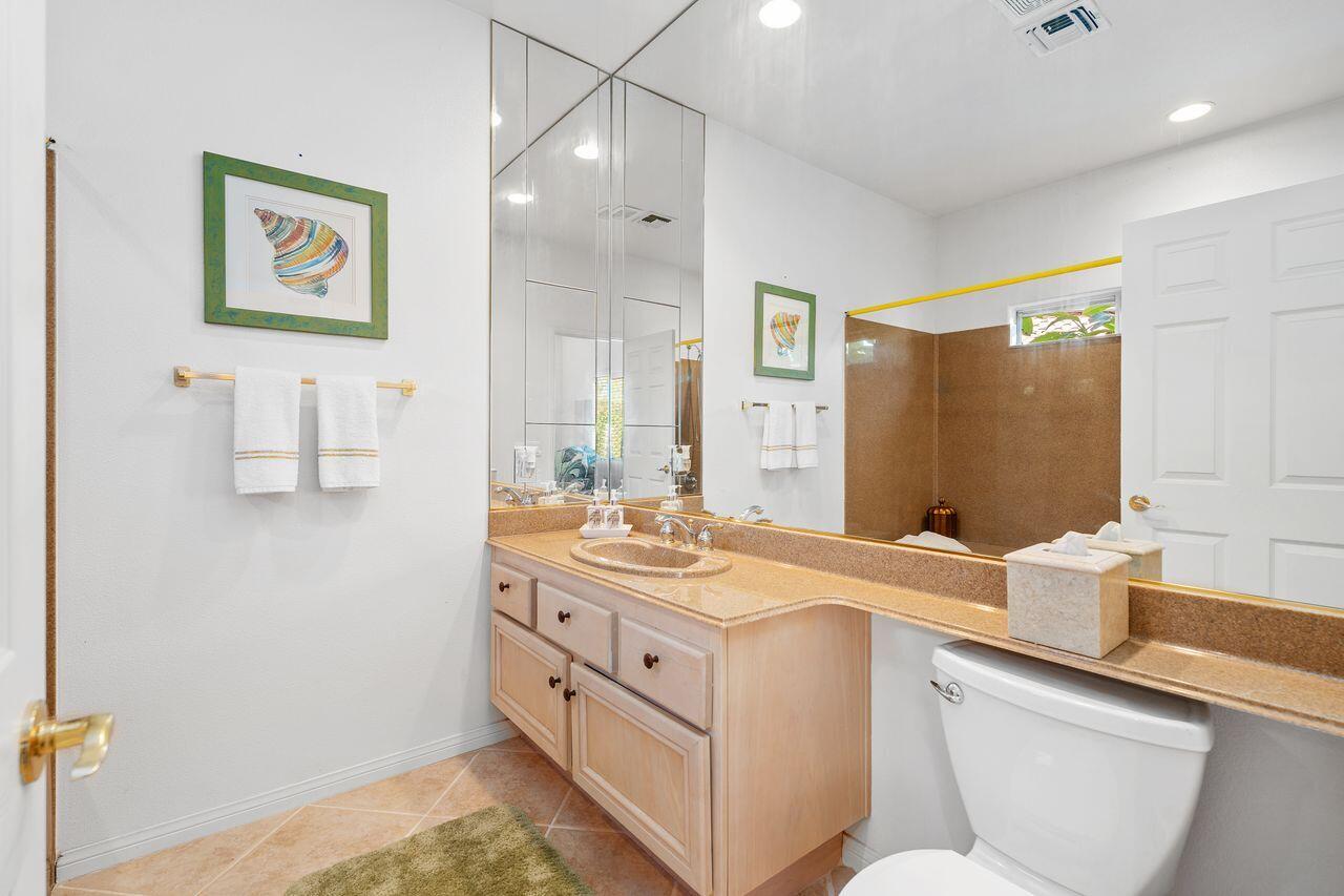 28 White Sun Way Rancho Mirage, CA 92270 - Photo 33 of 43 a bathroom with a granite countertop sink mirror and a