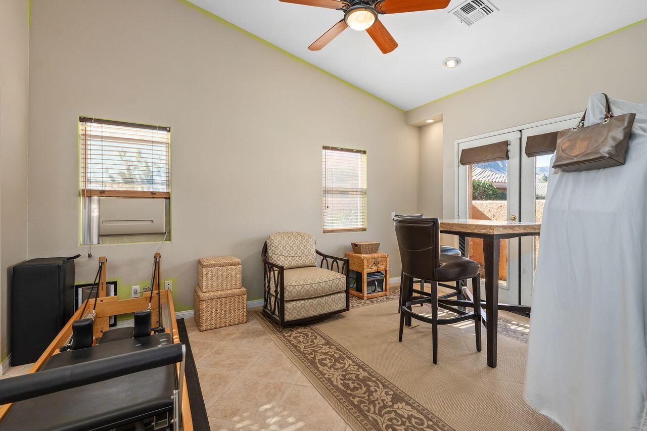 28 White Sun Way Rancho Mirage, CA 92270 - Photo 35 of 43 a living room with furniture a ceiling fan and a window