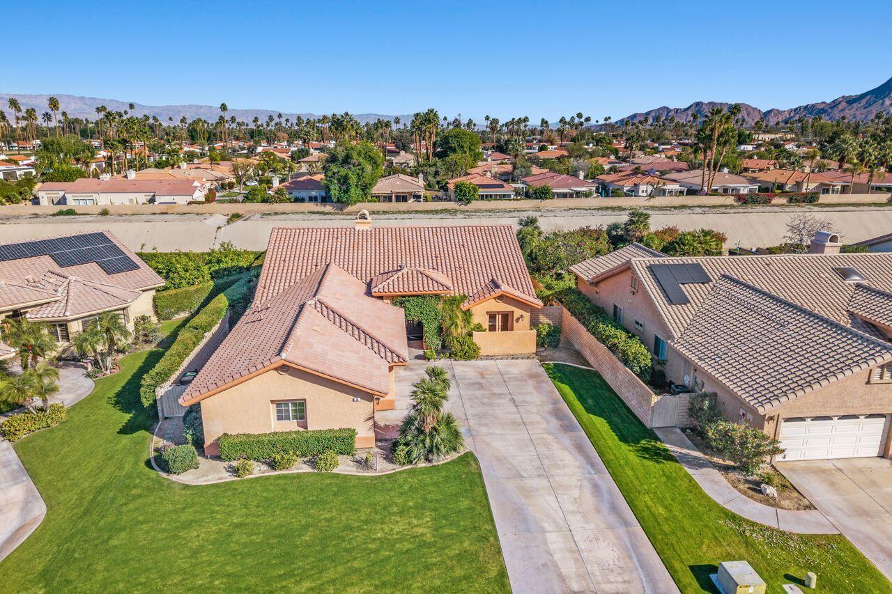 28 White Sun Way Rancho Mirage, CA 92270 - Photo 39 of 43 an aerial view of a house with a garden and lake view