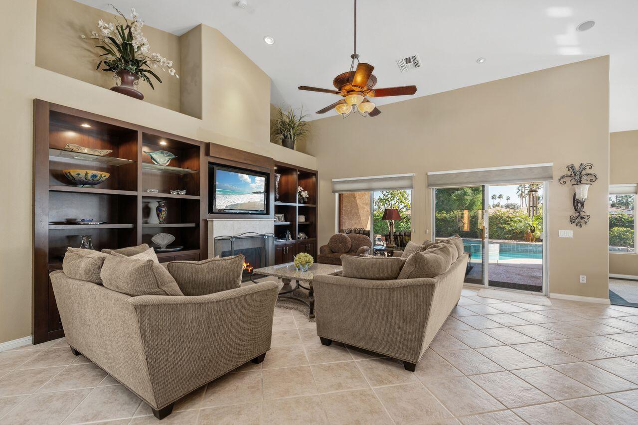 28 White Sun Way Rancho Mirage, CA 92270 - Photo 5 of 43 a living room with furniture and a flat screen tv