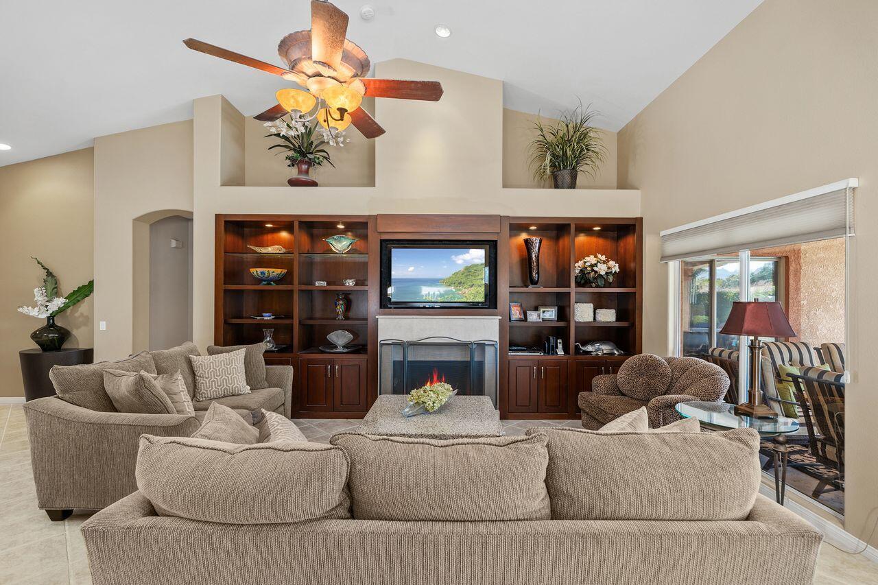 28 White Sun Way Rancho Mirage, CA 92270 - Photo 6 of 43 a living room with furniture and a flat screen tv