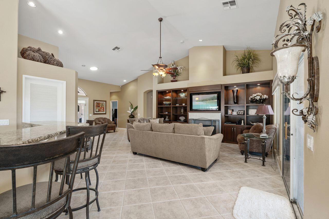 28 White Sun Way Rancho Mirage, CA 92270 - Photo 7 of 43 a living room with furniture and a chandelier