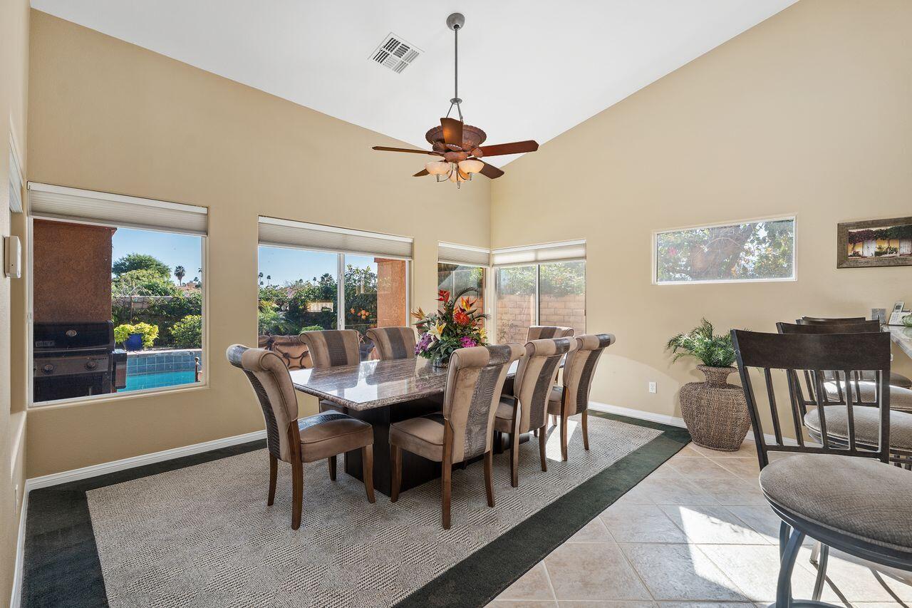 28 White Sun Way Rancho Mirage, CA 92270 - Photo 9 of 43 a view of a dining room with furniture window and wooden floor