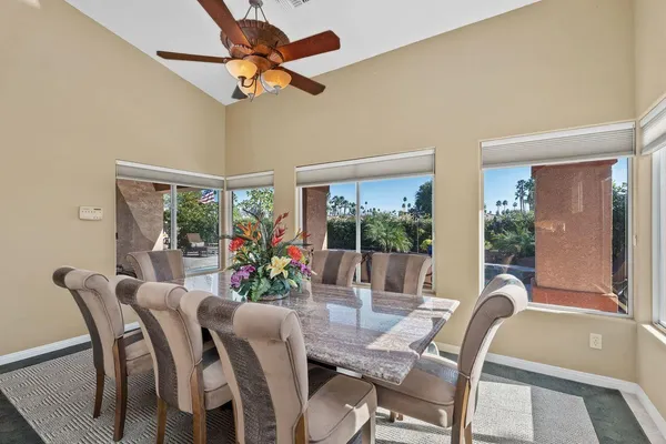 a view of a dining room with furniture window and outside view