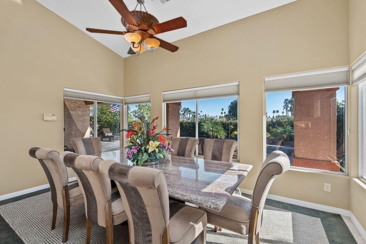 28 White Sun Way Rancho Mirage, CA 92270 - Photo 10 of 43 a view of a dining room with furniture window and outside view