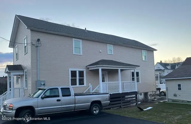 a car parked in front of a house