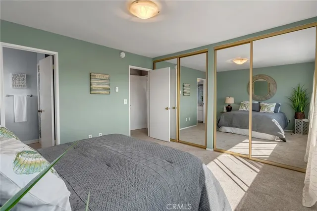 a bedroom with a bed and a glass door