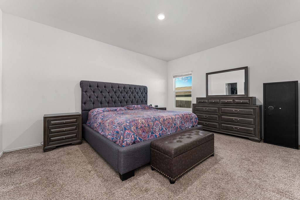 205 Rooster Way Jarrell, TX 76537 - Photo 9 of 29 Carpeted bedroom featuring recessed lighting and baseboards