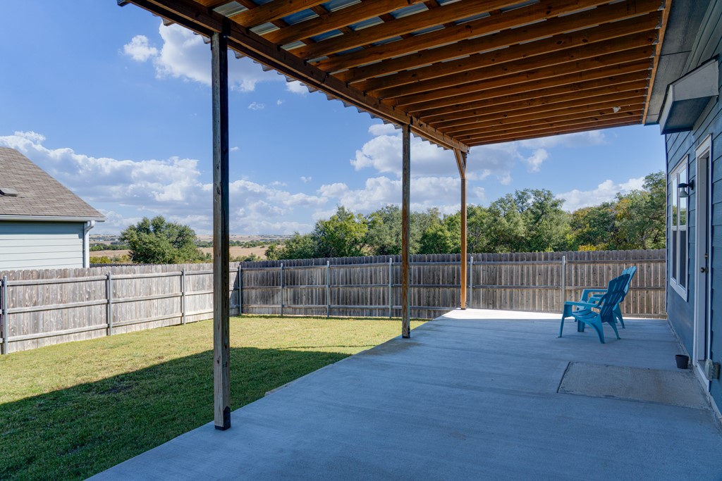 205 Rooster Way Jarrell, TX 76537 - Photo 20 of 29 Fenced backyard with a patio