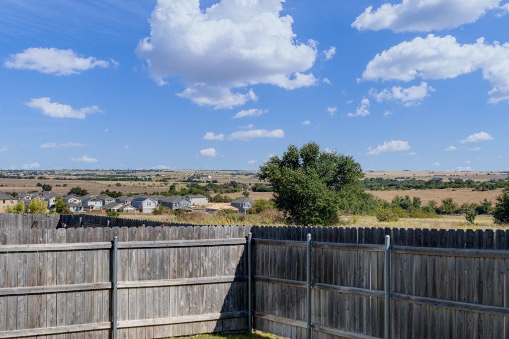 205 Rooster Way Jarrell, TX 76537 - Photo 21 of 29 Fenced backyard with a residential view