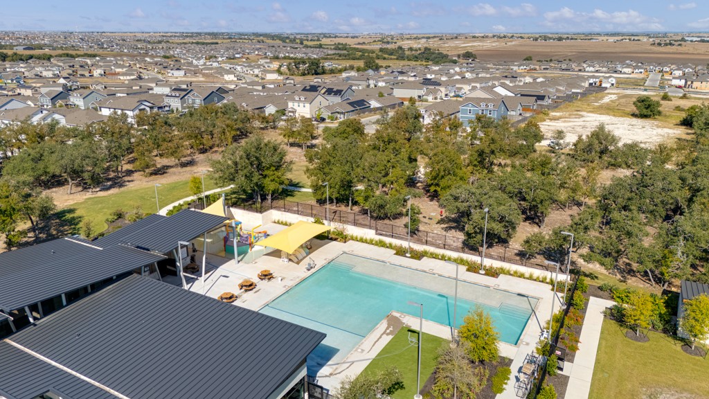 205 Rooster Way Jarrell, TX 76537 - Photo 22 of 29 Aerial perspective of suburban area with a pool