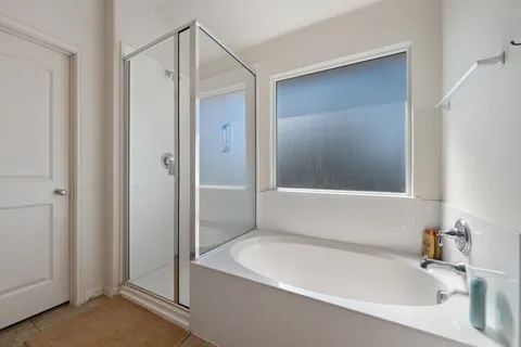 a white bath tub sitting next to a white sink