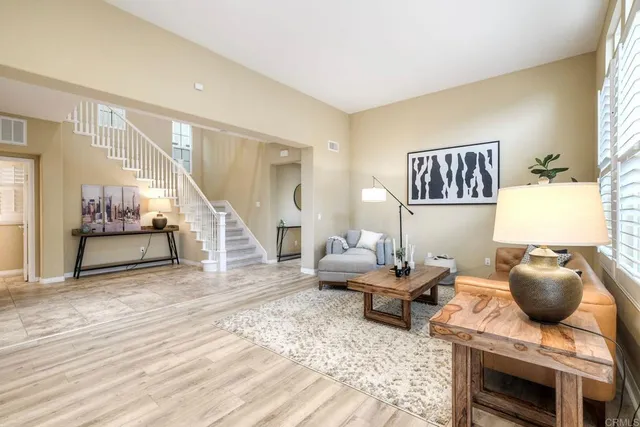 a living room with furniture and window