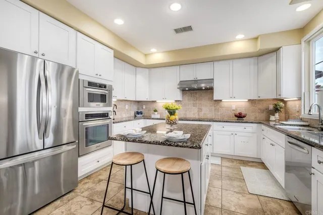 a view of a lush green outdoor space with a lake view