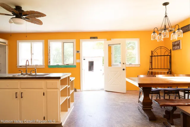 a view of a kitchen with furniture and window