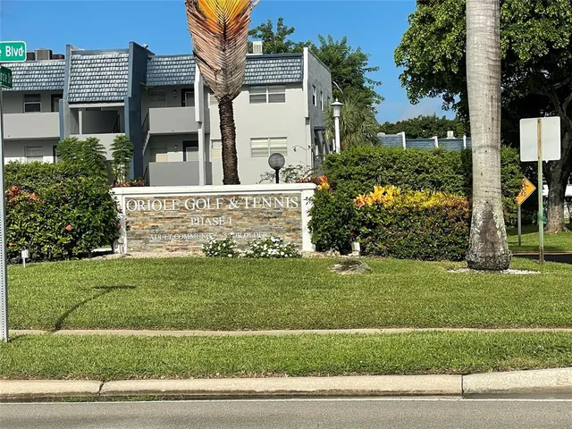 a kitchen with cabinets appliances and a sink