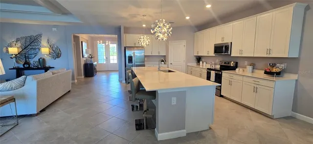 a kitchen with sink cabinets and window