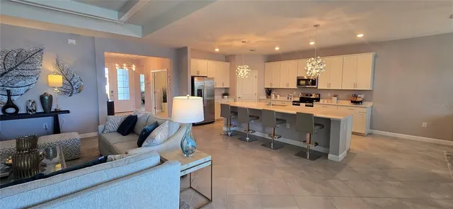 a bedroom with a bed a mirror and window