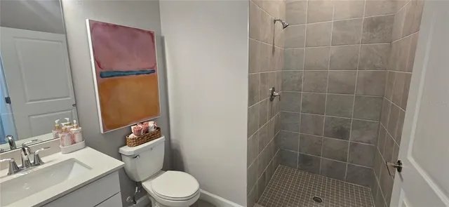 a dining room with furniture and a floor to ceiling window