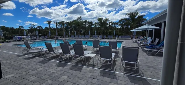 a view of a house with a cars park