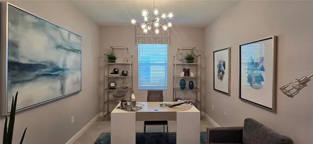 a view of a dining room with furniture and chandelier