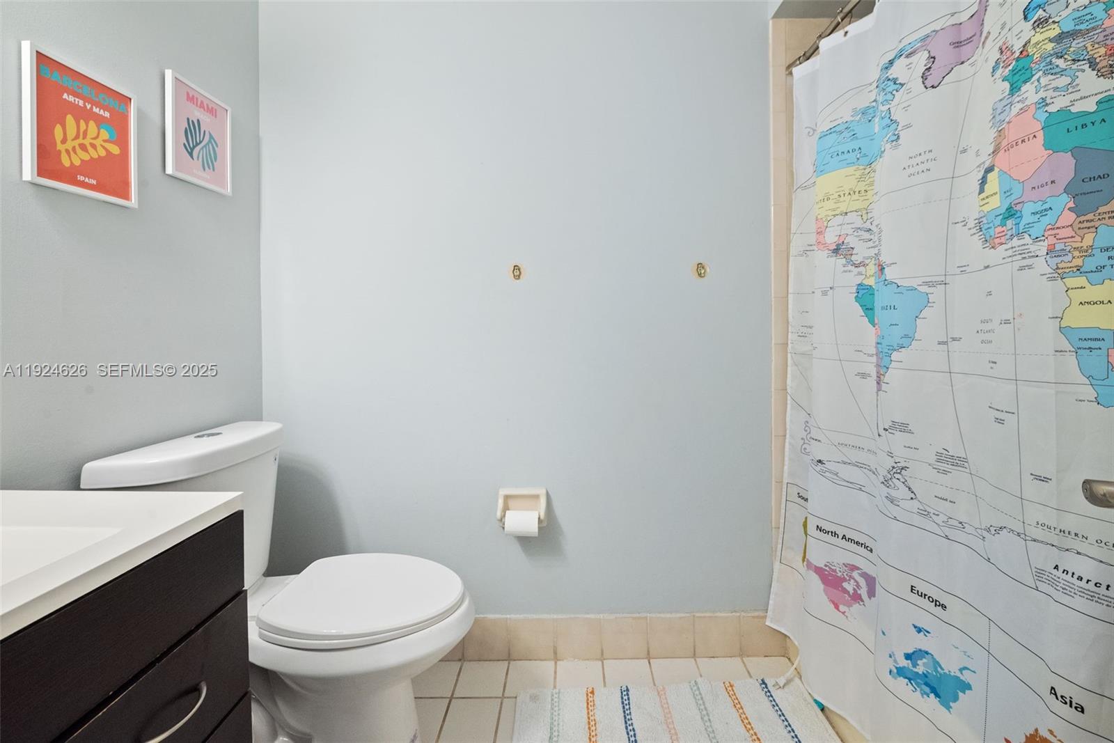 11840 Southwest 80th Street, Unit 526 Miami, FL 33183 - Photo 19 of 25 a bathroom with a sink toilet and vanity