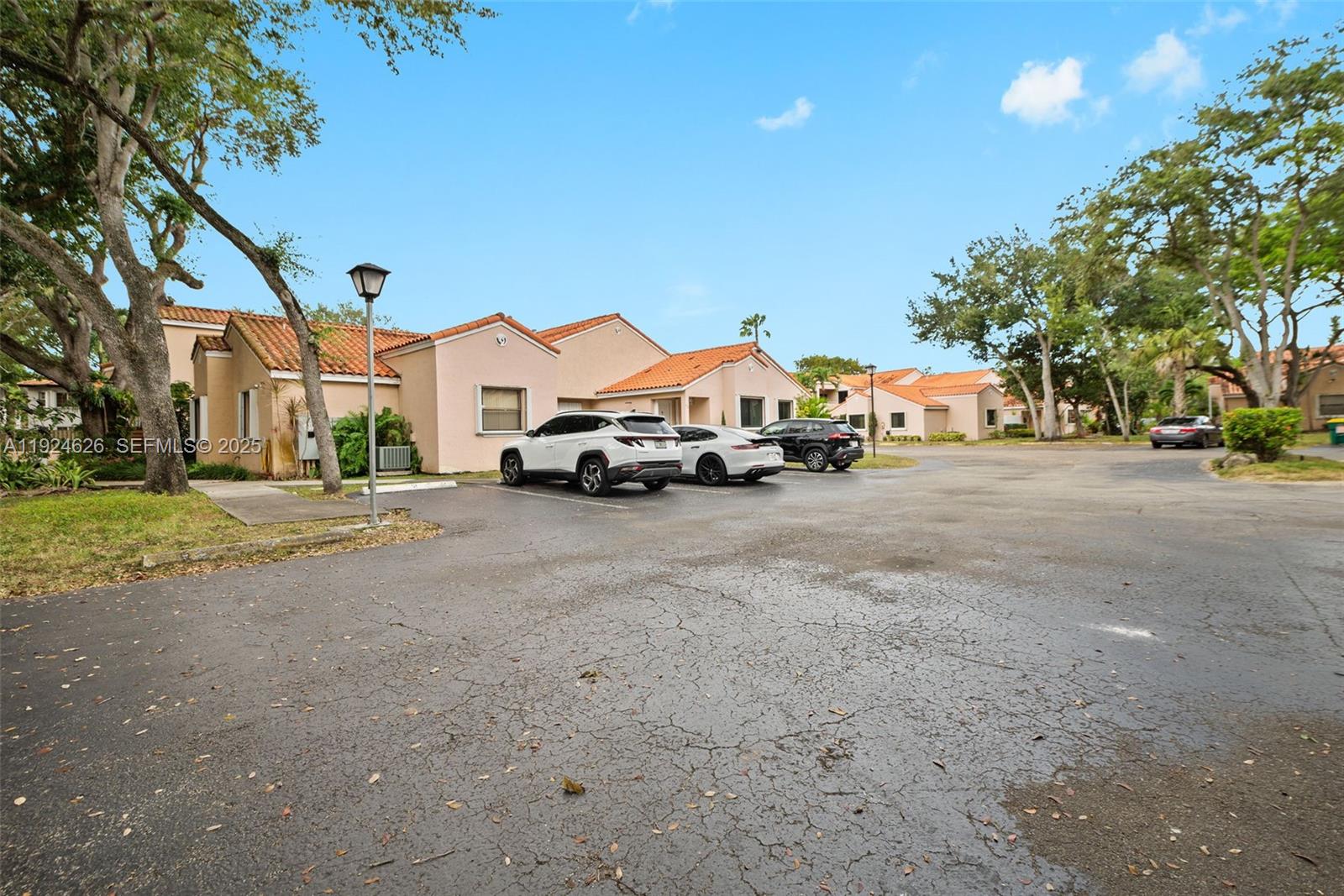 11840 Southwest 80th Street, Unit 526 Miami, FL 33183 - Photo 21 of 25 a view of street with parked cars