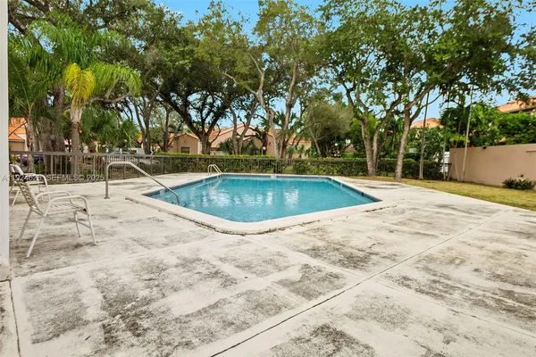a view of outdoor space and swimming pool